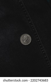 British Coin On Black Denim. Two British Shillings