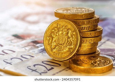 British coins stack on black, pound sterling,Business concept