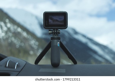 British Columbia, Canada - April 18, 2020: Go Pro Hero 8 Black Action Camera With Tripod Inside The Car With Mountains In The Background