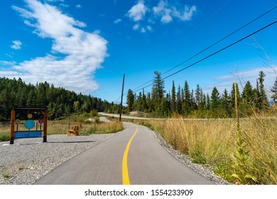 British Columbia, Canada. A landscape of a bike pathway with grasslands and forest near Invermere during summer.