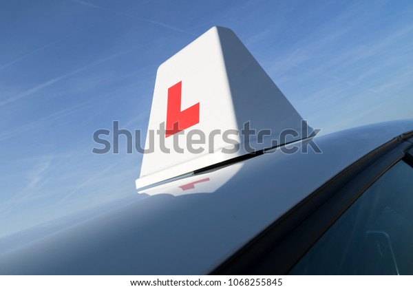 British driving school car\
roof sign