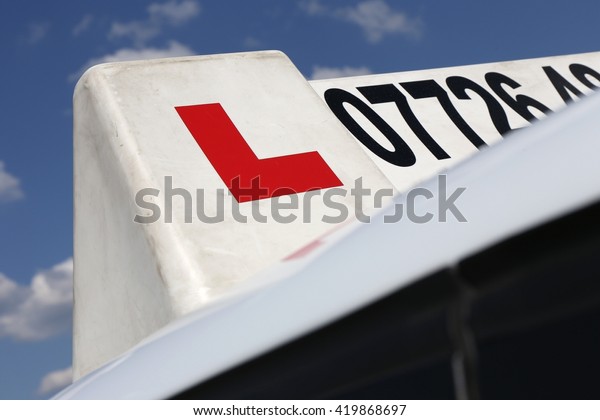 British driving school car
sign