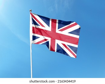 British flag with blue sky. waving blue sky