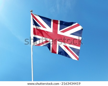 British flag with blue sky. waving blue sky