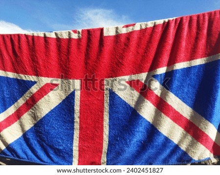 The British flag is drying in the clear sky