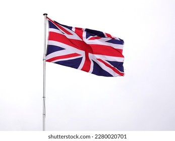 British flag flying at full mast in wind