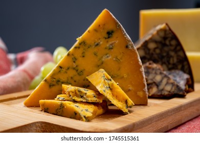 British And Irish Cheeses, Tasting Plate With Blue Shropshire, Brown Porter Cheese And Smoked Cheddar Close Up