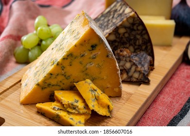 British And Irish Cheeses, Tasting Plate With Blue Shropshire, Brown Porter Cheese And Smoked Cheddar Close Up