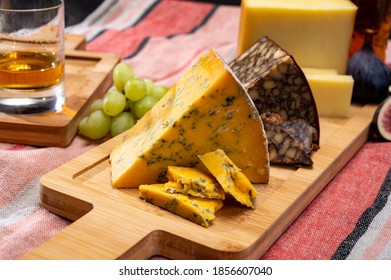 British And Irish Cheeses, Tasting Plate With Blue Shropshire, Brown Porter Cheese And Smoked Cheddar Close Up