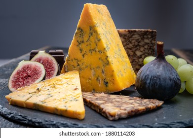 British And Irish Cheeses, Tasting Plate With Blue Shropshire, Brown Porter Cheese And Smoked Cheddar Close Up