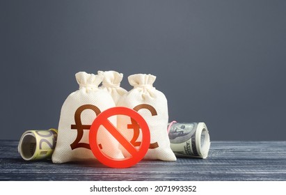 British money bags and red prohibition symbol No. Capital export outflow restrictions. Sanctions. Economy crisis. Freezing assets, banning transactions. Urgent stock market close.