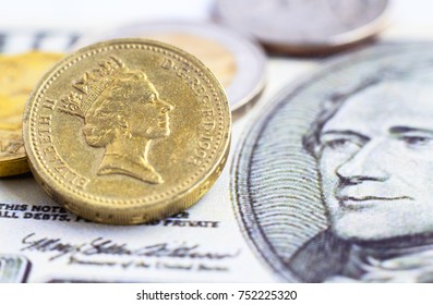 British One Pound Coin Versus Us Dollar Banknote. 