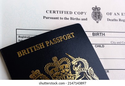 British passport and the Birth Certificates released by HM Passport Office in 2021. Selective focus. Stoke-on-Trent, United Kingdom, April 13, 2022.
