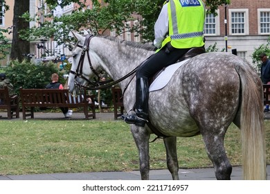 British Policeman On Horseback Patrolling At Soho Square, London, Preparing A Major Event, Guarding The City