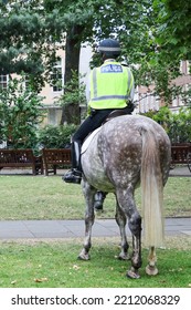 British Policeman On Horseback Patrolling At Soho Square, London, Preparing A Major Event, Guarding The City