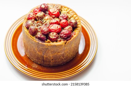 British pork pie topped with whole cranberries and  a rich ruby port jelly, traditional English food