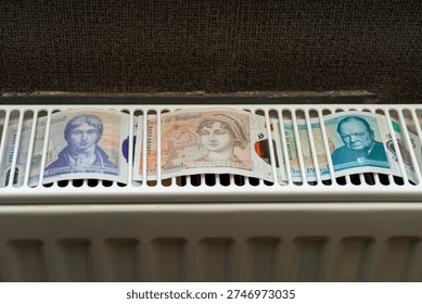 British pound notes are placed on a heater inside a home. The notes show different designs and faces, drying after being washed. The setting gives a glimpse of everyday life.