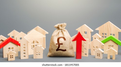 British pound sterling money bag and a city of house figures and red up arrow. Investments. Increase in revenues to municipal budget. Rent growth. Recovery and growth in property prices, high demand.
