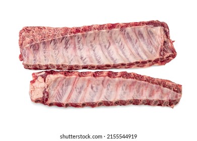 British raw pork ribs on wooden chopping board, raw meat on white background. Raw pork ribs. Ready for cooking.