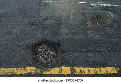 British Roads With A Pot Hole A Cycle Hazard. Manchester, England, UK.