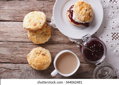 British scones with fruit jam and whipped cream close-up on the table. Horizontal top view
 - Powered by Shutterstock