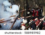 British soldiers and Militia fighting along Battle Road in Lexington, MA during the Commemorating the Patriot Day.