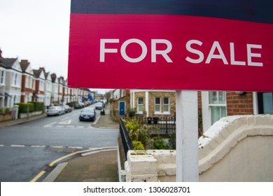 British street with 'For Sale' sign