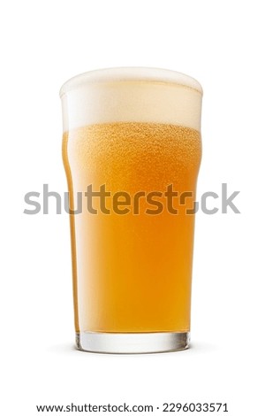 British style imperial pint glass of fresh hazy wheat unfiltered beer with cap of foam isolated on white background.