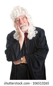 British Style Judge Wearing A Wig And A Bored Expression.  Isolated On White.