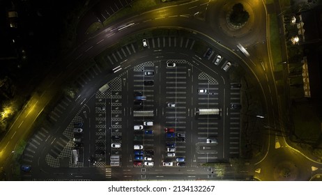 British Supermarket Car Park Top Down Birdseye Aerial View With Parked Cars At Night