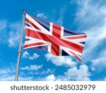 British Union Jack flag blowing in the wind on flag pole