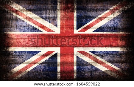 British Union Jack flag painted on old plank dark wall