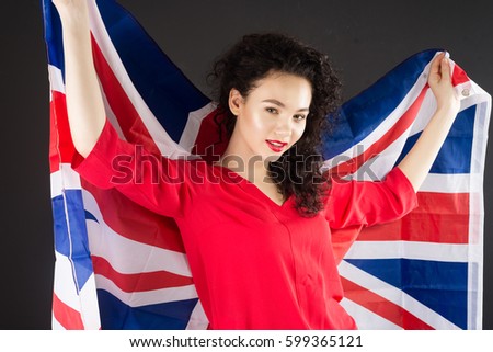 
British woman holding the Jack Union flag.
