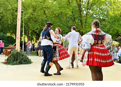 Brno - Bystrc, Czech Republic, June 25, 2022.  Traditional Czech feast. Folk Festival. Girls and boys dancing in beautiful costumes. An old Christian holiday, a day of abundance, joy and prosperity.