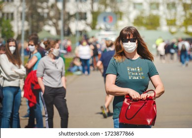 Brno, Czech Republic - April 23 2020: Woman Wearing A Cloth Face Mask. She Is Waiting In Long Queue Of People For A Test As Part Of A Study On Collective Immunity Against The Corona Virus.