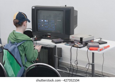 BRNO, CZECH REPUBLIC - APRIL 30, 2016: Boy Plays Gaming Console With Television At Animefest, Anime Convention On April 30, 2016 Brno, Czech Republic 