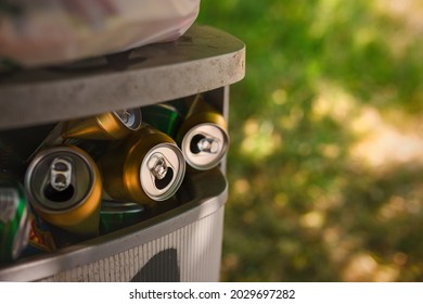 Brno, Czech Republic - June 27 2021: Close-up of a bin overflowing with empty beer flats. The concept of environmental pollution. - Shutterstock ID 2029697282
