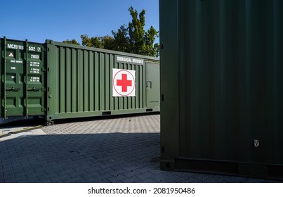 Brno, Czechia - October 08, 2021: Green Metal Army Container Box - Surgical Module - With Red Cross, Setup As Field Ambulance Demonstration During IDET Military And Defence Exhibition Fair