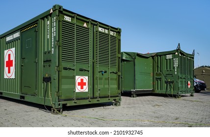 Brno, Czechia - October 08, 2021: Green Metal Army Container Box - Surgical Module - With Red Cross, Setup As Field Ambulance Demonstration During IDET Military And Defense Exhibition Fair