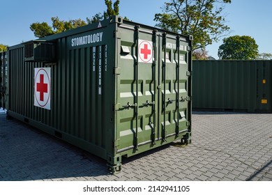 Brno, Czechia - October 08, 2021: Green Metal Army Container Box - Stomatology Module - With Red Cross, Setup As Field Ambulance Demonstration During IDET Military And Defense Exhibition Fair