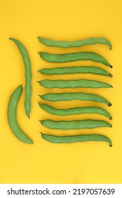 Broad Bean Green Vegetable Organic Health Food, High In Folate, Fibre, Antioxidants, Potassium And Vitamin B. Natural  Produce To Lower Cholesterol. Abstract Design On Yellow Background, 