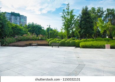 Broad Squares And Quiet City Parks, Green Meadows, Lush Forests And Blue Sky And White Clouds