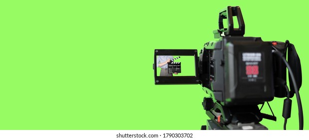 Broadcast camera in studio with green screen at TV station. - Shutterstock ID 1790303702