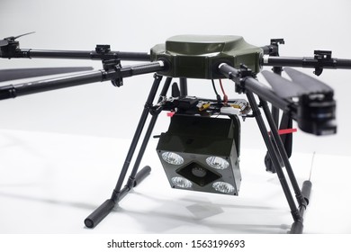 Broadcast Searchlight Drone. A Flying Helicopter