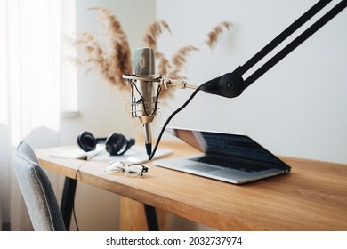 Broadcast Studio. Podcast Interior. Tiny Room For Podcaster. Microphone And Laptop On The Table	