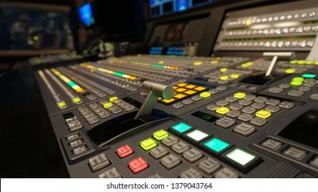 Broadcast Television Switcher In News Studio With Blur Background.