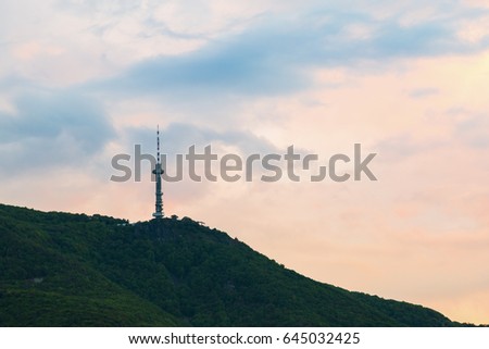 Broadcasting tower on a mountain top viewed at sunset in Sofia, Bulgaria in a communications concept. Vitosha mountain