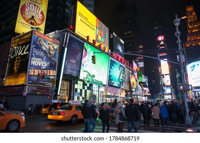 Broadway In NYC . :Night Street Broadway In New York City . Yellow Taxi, Many People And Advertising Outdoor. NEW YORK, USA - SEPTEMBER 20, 2013