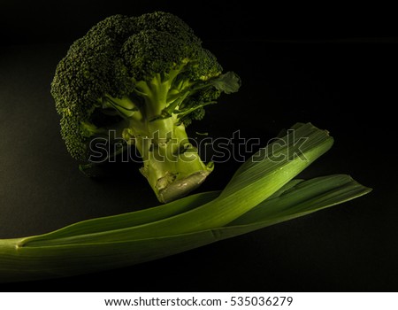 Small pieces of raw broccoli on white wood, Close up