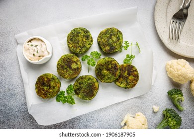 Broccoli And Cauliflower Green Fritters Or Pancakes With Sauce, Top View